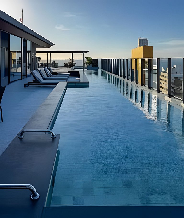 Studio c/ Rooftop e piscina vista Mar 1km da praia